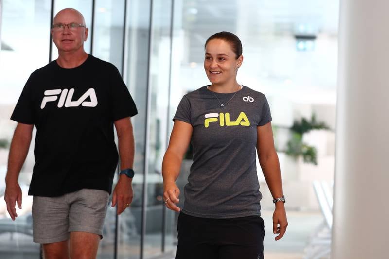 Ashleigh Barty and coach Craig Tyzzer arrive for a press conference in Brisbane. Getty