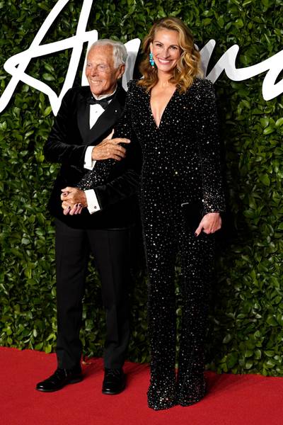 epa08040221 US actress Julia Roberts (R) and Italian fashion designer Giorgio Armani (L) arrive for The Fashion Awards at the Royal Albert Hall in Central London, Britain, 02 December 2019. The awards showcases individuals and businesses that have contributed to the British fashion industry.  EPA-EFE/WILL OLIVER