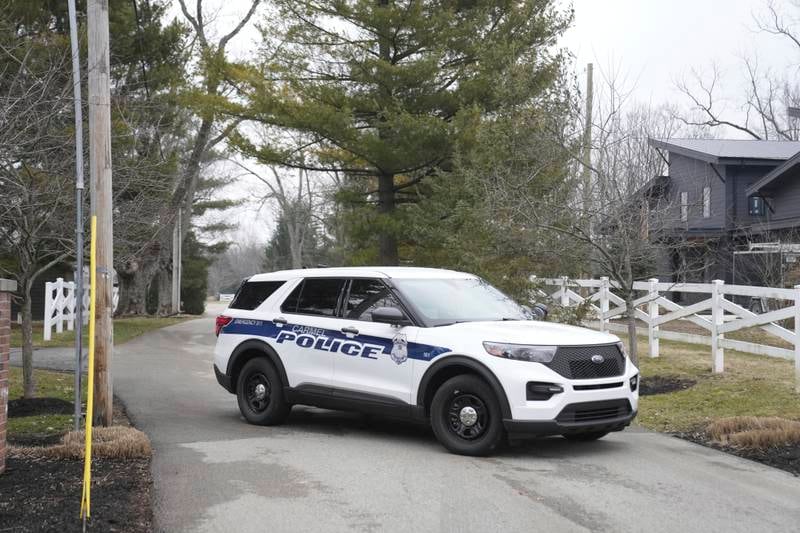 Police secure the entrance to former vice president Mike Pence's home in Carmel, Indiana. AP