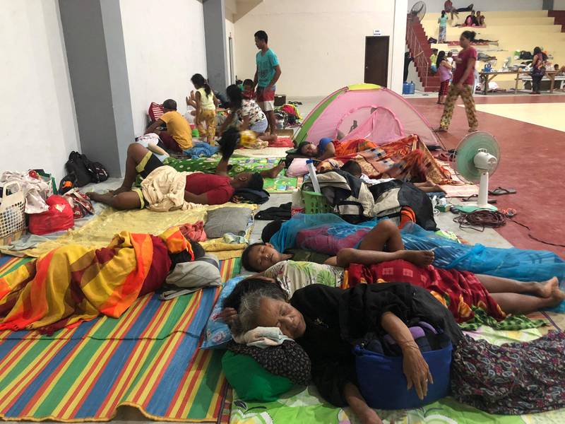 Residents bed down for the night at the sports complex. Photo: AFP