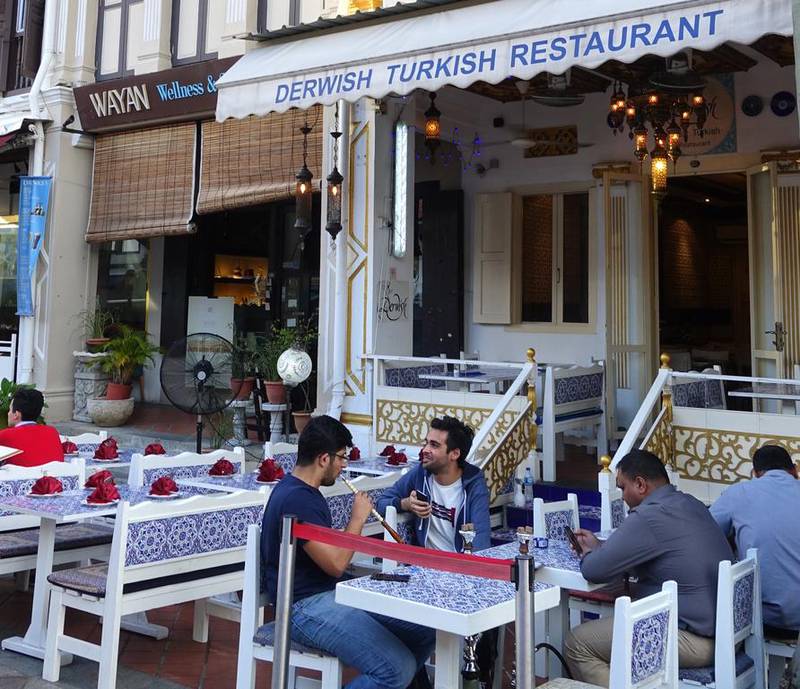  Shisha smokers outside the Derwish Turkish restaurant on Bussorah Street in the Arab Street-Kampong Glam precinct of Singapore’s famed Muslim quarter on July 29, 2016. Courtesy Lee Yong Wei                               