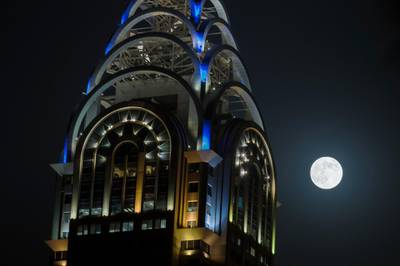 DUBAI, UNITED ARAB EMIRATES, AUGUST 10, 2014. The super moon rises over Media City in Dubai. (Photo: Antonie Robertson/The National) Journalist: None.Section: National.