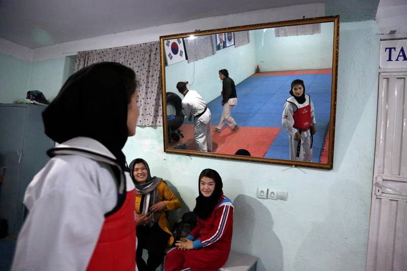 Under the Taliban, women were not allowed to go to school, work outside the home or leave their house without a male escort. AP
