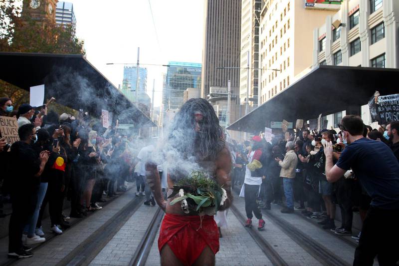Aboriginal elders conduct a traditional smoking ceremony at Town Hall during a 'Black Lives Matter' protest on June 6, 2020 in Sydney, Australia. Getty
