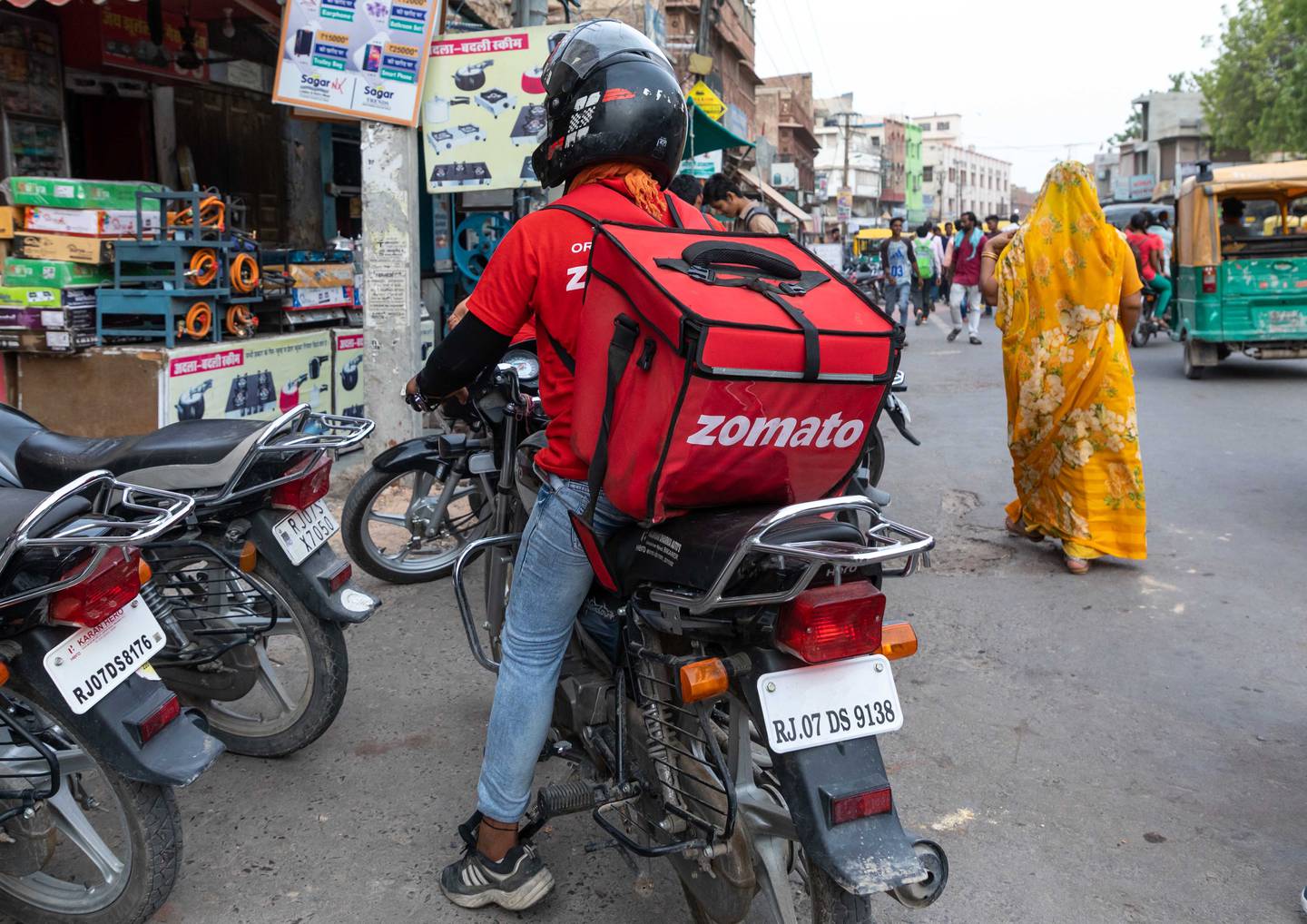 BIKANER, INDIA - JULY 25: A biker from the popular take away food delivery company Zomato, Rajasthan, Bikaner, India on July 25, 2019 in Bikaner, India. (Photo by Eric Lafforgue/Art in All of Us/Corbis via Getty Images)