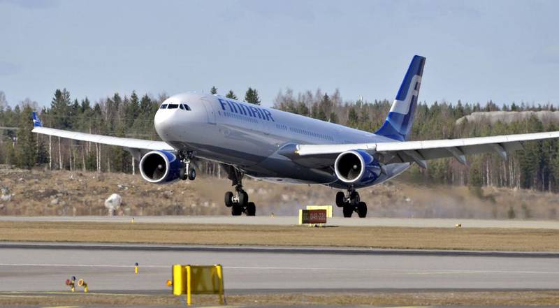 A Finnair jetliner lands at the Helsinki-Vantaa International Airport in Helsinki. Jussi Nukari / AFP