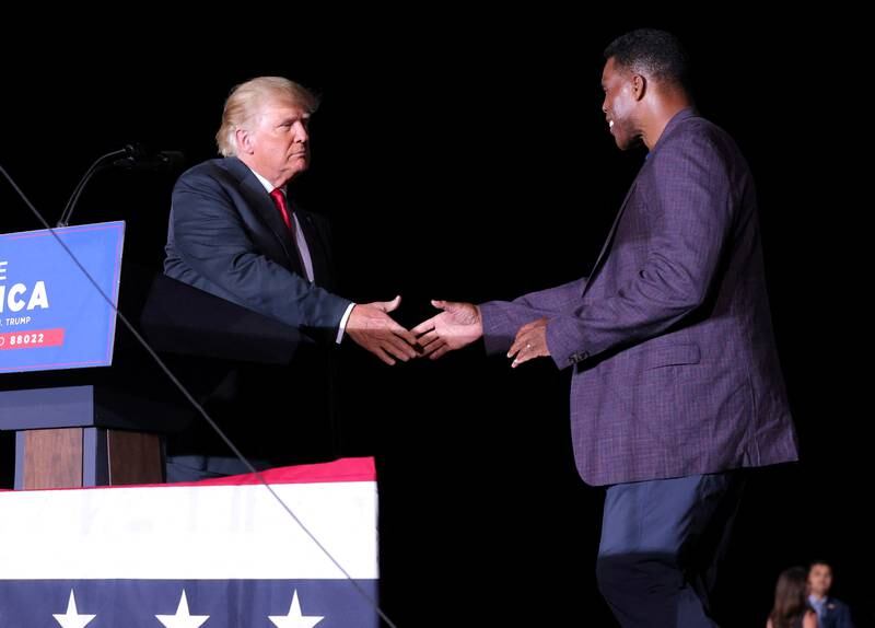 Donald Trump gave Herschel Walker his backing in the Georgia Senate race. Reuters