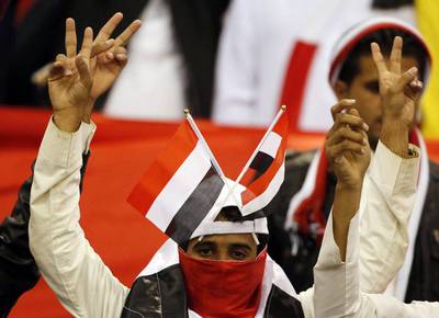 A Yemeni fan shows his support before his team's match against Qatar, which ended in a 0-0 draw, on Sunday at the 2014 Gulf Cup of Nations in Riyadh. Karim Sahib / AFP