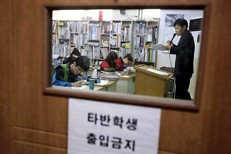 Students at the Deung Yong Moon institute in Gwangju, near Seoul. South Korean families spend a lot of their income on education. Kim Hong-Ji / Reuters