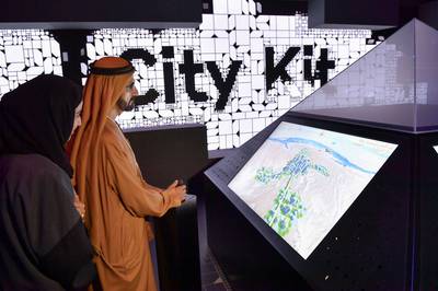 Sheikh Mohammed bin Rashid tries out some of the museum's technological features. Wam