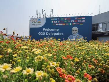 New Delhi decorated with flowers and Modi posters for G20