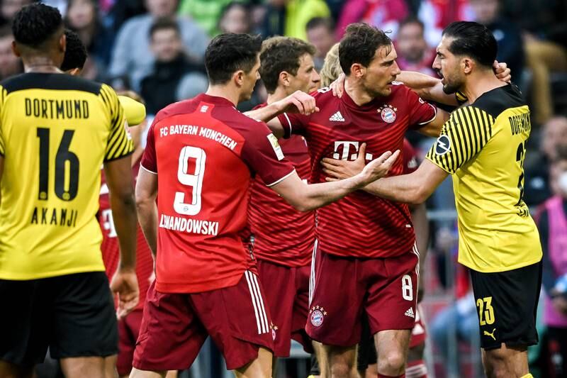 Bayern's Leon Goretzka argues with Dortmund's Emre Can. EPA