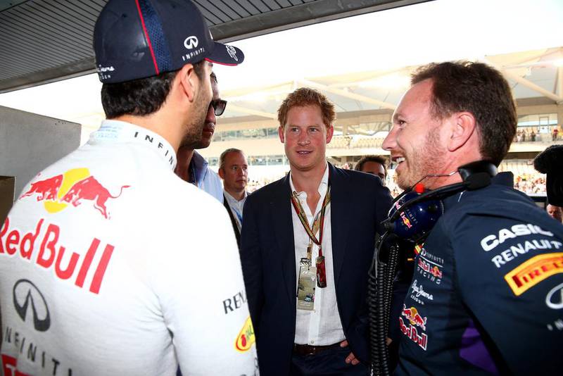 Britain's Prince Harry speaks with Red Bull Racing's Daniel Ricciardo and team principal Christian Horner in the team garage before the Abu Dhabi Grand Prix. Mark Thompson / Getty Images 