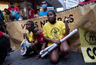 Children take part in a protest against racism and police violence during a "Black Lives Matter" demonstration  in Duque de Caxias, Brazil. AP Photo