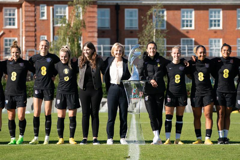 British Prime Minister Liz Truss with members of the England women's football team and the European Championship trophy at the Lensbury Resort, Teddington, on Monday, after their Euro 2022 victory in July. PA