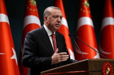 Turkish President Recep Tayyip Erdogan gestures as he delivers a speech following a cabinet meeting, in Ankara, on June 9, 2020.  / AFP / Adem ALTAN
