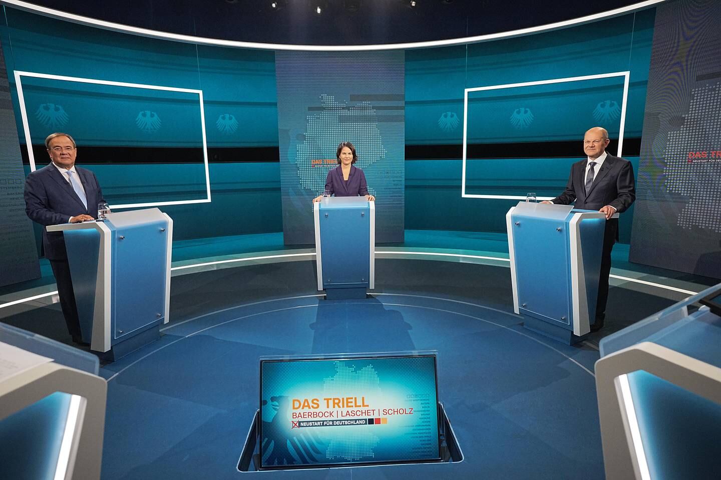 Chancellor candidates Armin Laschet, Annalena Baerbock and Olaf Scholz during a televised debate on Sunday. EPA 