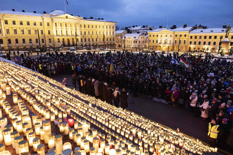 People gather for "Light to Ukraine" in Helsinki, Finland, on the anniversary of the Russian invasion of Ukraine. AFP
