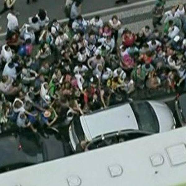 Video: Crowds swarm papal car as Pope Francis arrives in Brazil