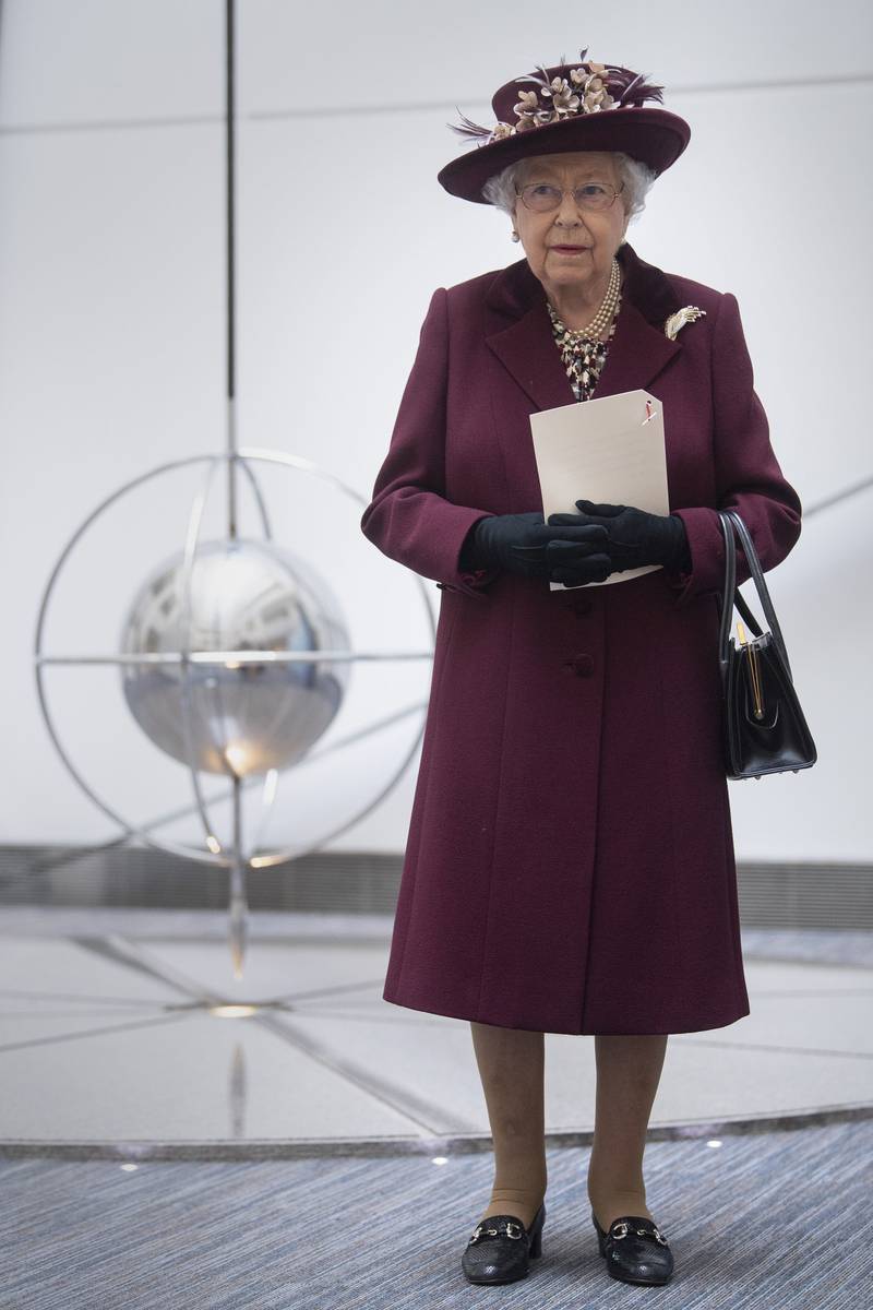 Queen Elizabeth II, wearing claret, visits the headquarters of MI5 at Thames House, London, on February 25, 2020. Getty Images