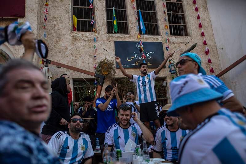 Fans of Argentina cheer at Souq Waqif. EPA