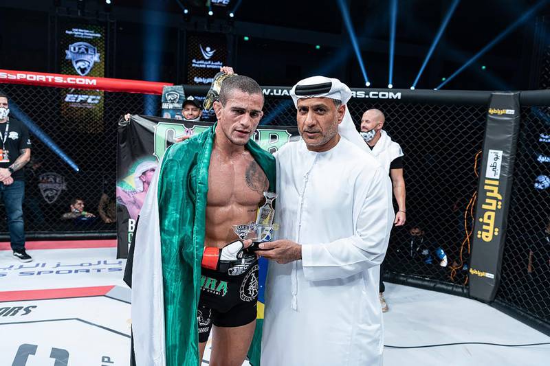 Bruno Machado receives his award from chairman of Palms Sports Abdulmunam Al Hashemi in the UAE Warriors 15 at the Jiu-Jitsu Arena on Friday, January 15, 2021. Courtesy UAE Warriors