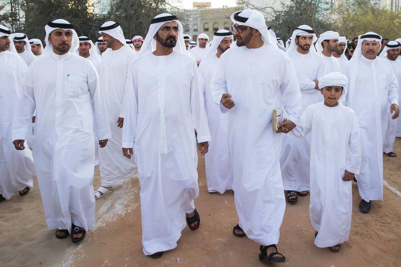 Sheikh Mohammed bin Zayed, Crown Prince of Abu Dhabi, centre, Sheikh Mohammed bin Rashid, Vice President and Ruler of Dubai, left, and Sheikh Zayed bin Mohammed bin Hamed bin Tahnoon Al Nahyan, right, tour the fort during the Qasr Al Hosn Festival. Silvia Razgova / Crown Prince Court - Abu Dhabi
