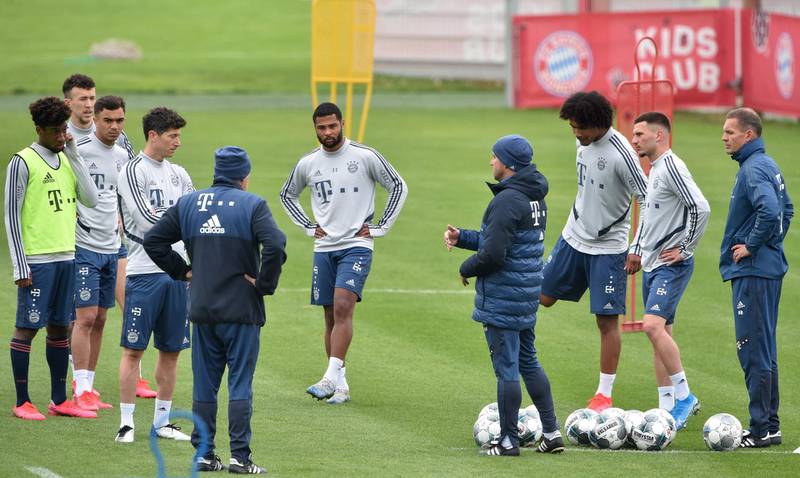 Bayern Munich manager Hansi Flick talks to his players. AFP