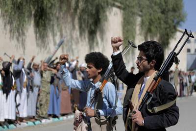 Tribesmen loyal to Houthi rebels chant slogans with weapons during a gathering aimed at mobilizing more fighters for the Houthi movement in Sanaa, Yemen, Tuesday, Feb. 25, 2020. (AP Photo/Hani Mohammed)