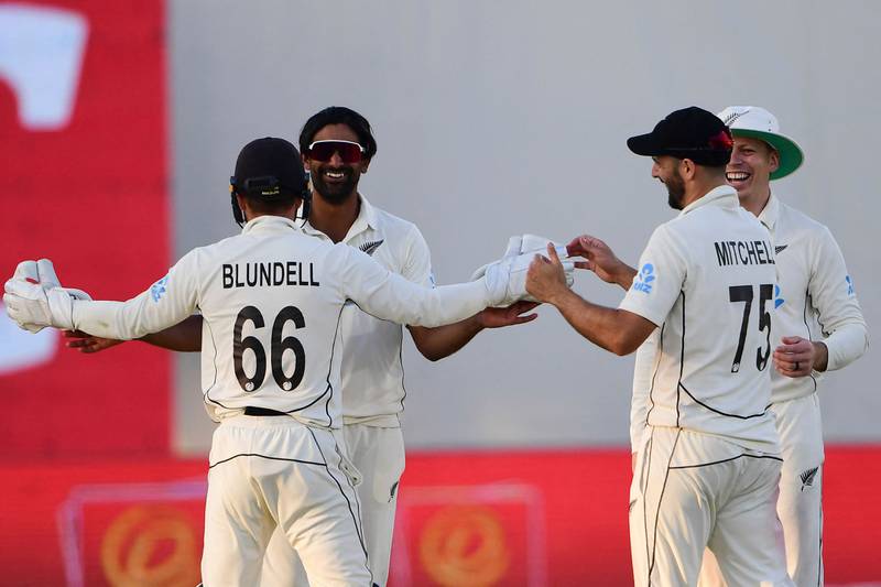 New Zealand's Ish Sodhi celebrates with teammates after taking the wicket of Pakistan Mir Hamza. AFP