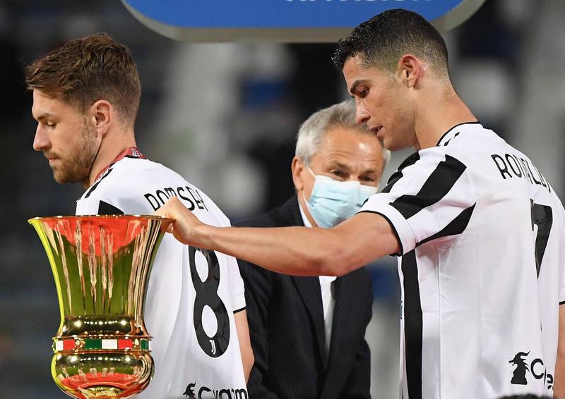 Ronaldo touches the trophy after winning the Coppa Italia . Reuters