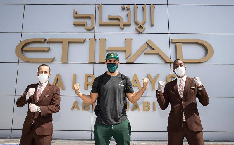 Dominick Reyes, accompanied by Etihad staff, arrives in Abu Dhabi from Las Vegas. Courtesy Etihad
