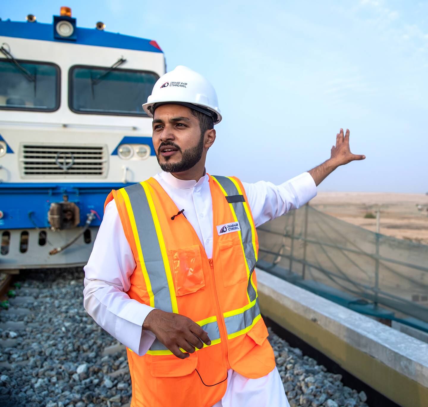 Ahmed Al Hashemi, executive director of passengers sector, at Etihad Rail on the bridge over the E77 Expo Road. Behind is an inspection train that tests the line. Victor Besa / The National