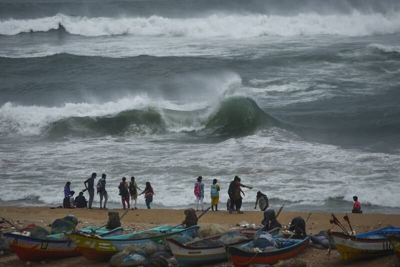 People watch high waves approaching the shore due to the formation of cyclonic storm Asani in the Bay of Bengal, Chennai, India. EPA