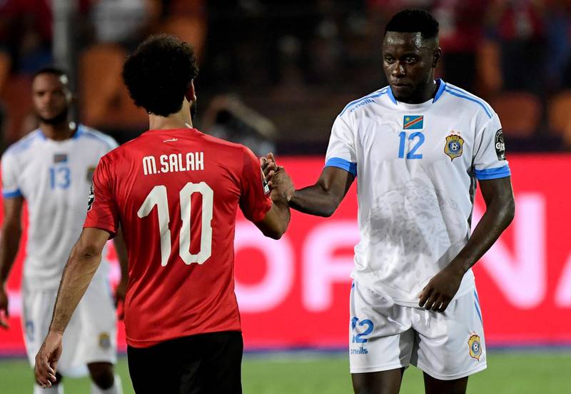 Egypt forward Mohamed Salah shakes hands with DR Congo defender Wilfred Moke after the match. AFP