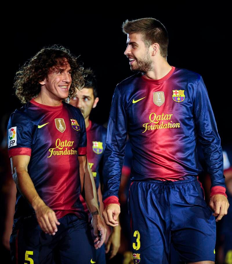 Carles Puyol, left, formed a formidable defensive partnership with Gerard Pique during their time together at Barcelona. Getty Images
