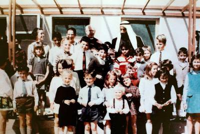 Sheikh Zayed's Visit to The British School Al Khubairat in the 1970s. Kathryn Lamb is on the far right in a blue dress. Courtesy The British School Al Khubairat