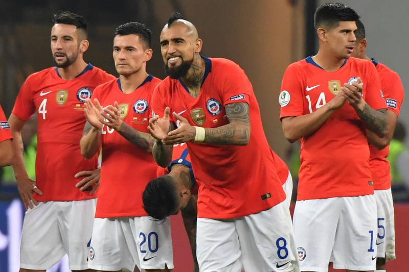 Chile midfielder Arturo Vidal cheers on teammates during the penalty shootout. AFP