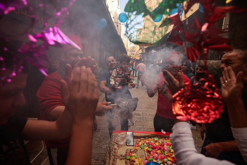 Palestinians burn incense as they celebrate the Prophet Mohammed's birthday, in the West Bank city of Nablus.