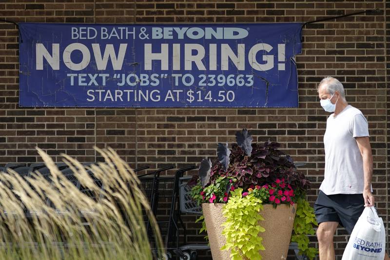A hiring sign is displayed in Deerfield, Illinois. AP