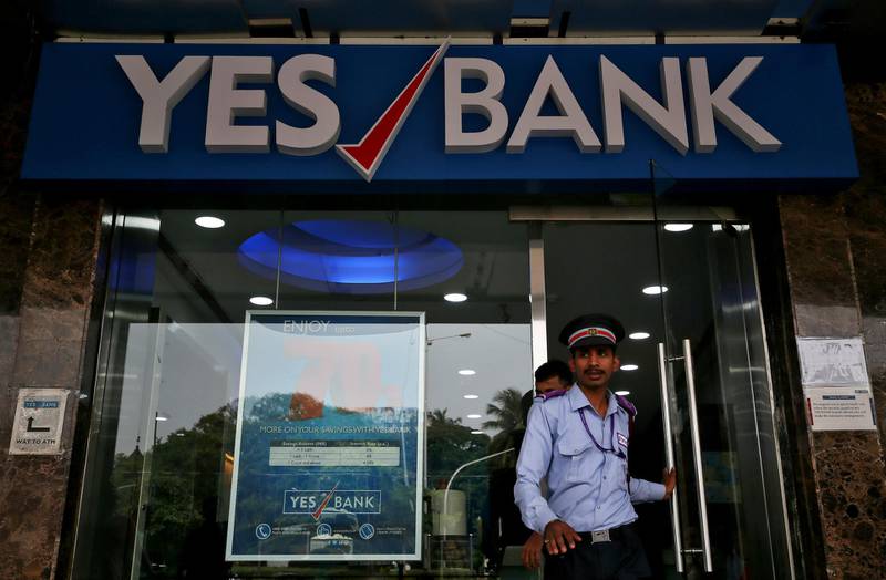 FILE PHOTO: A watchman steps out of a Yes Bank branch in Mumbai, India, September 21, 2018. REUTERS/Francis Mascarenhas/File Photo