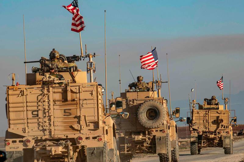 A convoy of US armoured vehicles patrols the village of Ein Diwar in Syria's northeastern Hasakeh province.  AFP