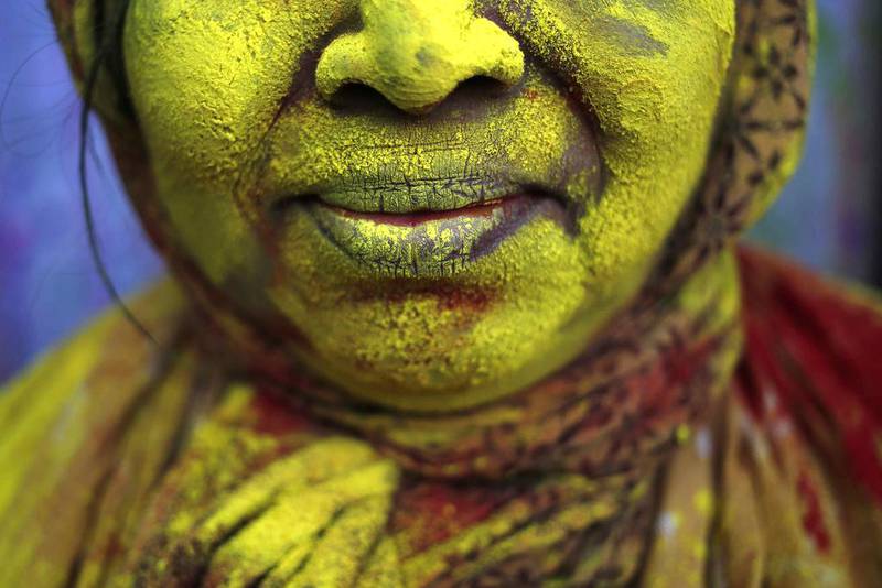 The face of a widow is seen daubed in colour after she took part in the Holi celebrations organised by non-governmental organisation Sulabh International at a widows’ ashram at Vrindavan in the northern Indian state of Uttar Pradesh March 4. Anindito Mukherjee / Reuters