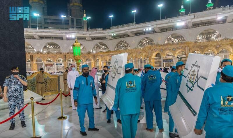 Physical distancing stickers are removed from the Grand Mosque after Saudi Arabia lifted the requirement to wear masks and observe social distancing in open spaces. All photos: SPA
