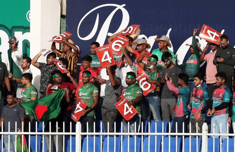 Fans during the match at Sharjah Cricket Stadium.