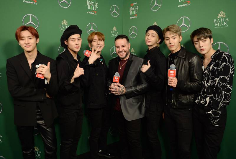 NEW YORK, NEW YORK - DECEMBER 13: Mo' Bounce (C) poses for a photo with (L-R) I.M, Jooheon, Kihyun, Hyungwon, Shownu, Minhyuk of Monsta X backstage at iHeartRadio's Z100 Jingle Ball 2019 presented by Capital One on December 13, 2019 in New York City.   Brad Barket/Getty Images for iHeartMedia/AFP