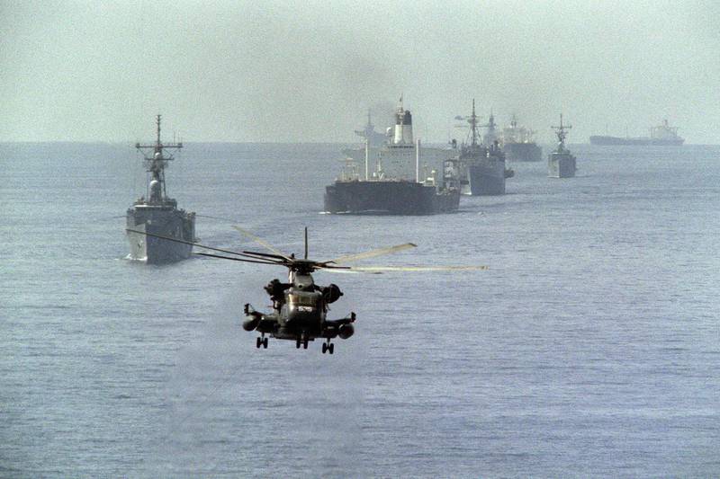 A  US Navy minesweeping helicopter leads the way for a US reflagged Kuwaiti tanker convoy, on October 22, 1987, in the Arabian Gulf. AFP