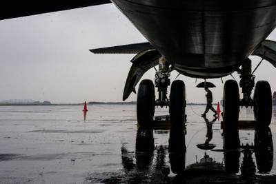 A soldier walks past the front wheels of a B-52H strategic bomber at Cheongju Airport in South Korea. AFP