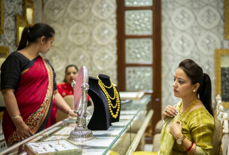 A customer browses jewellery at a shop ahead of Diwali in New Delhi. Bloomberg