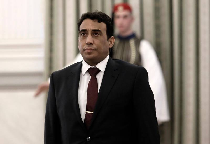 FILE - In this Tuesday, Dec. 18, 2018 file photo Mohamed Younis A.B. Menfi Ambassador of Libya in Greece attends a ceremony at the Presidential Palace in Athens. Greece's foreign minister says on Friday, Dec. 6, 2019, his country is expelling the Libyan ambassador in the latest escalation of a dispute over a controversial deal between Libya's UN-supported government and Turkey on maritime boundaries in the Mediterranean. (John Liakos/InTime News via AP, File)